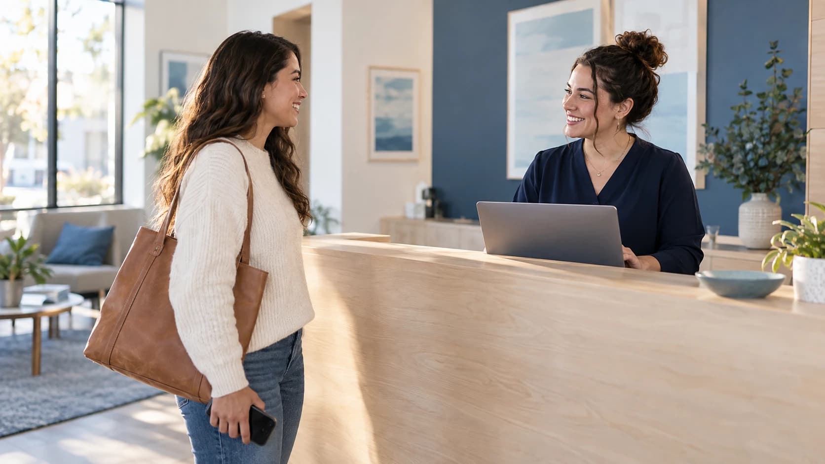 A coordinator welcoming a customer for a scheduled visit