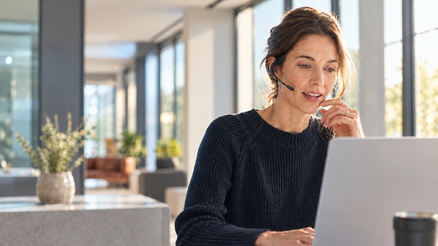An advisor listening to a customer in a bright office